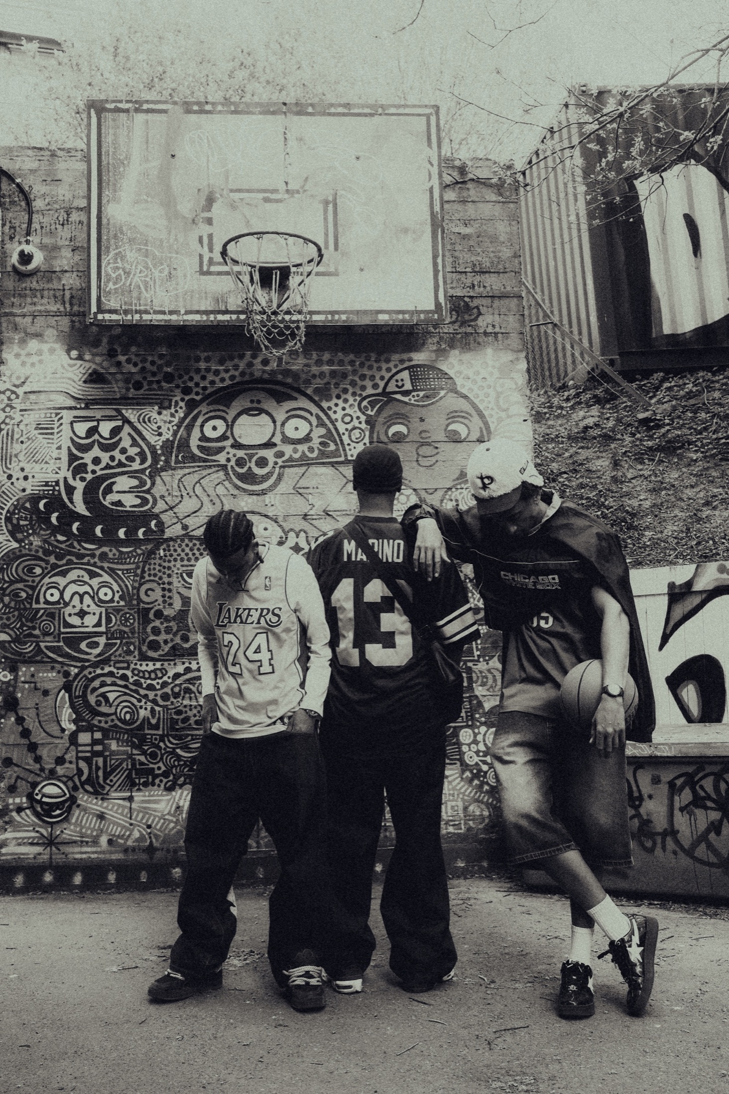 Group portrait in front of a mural