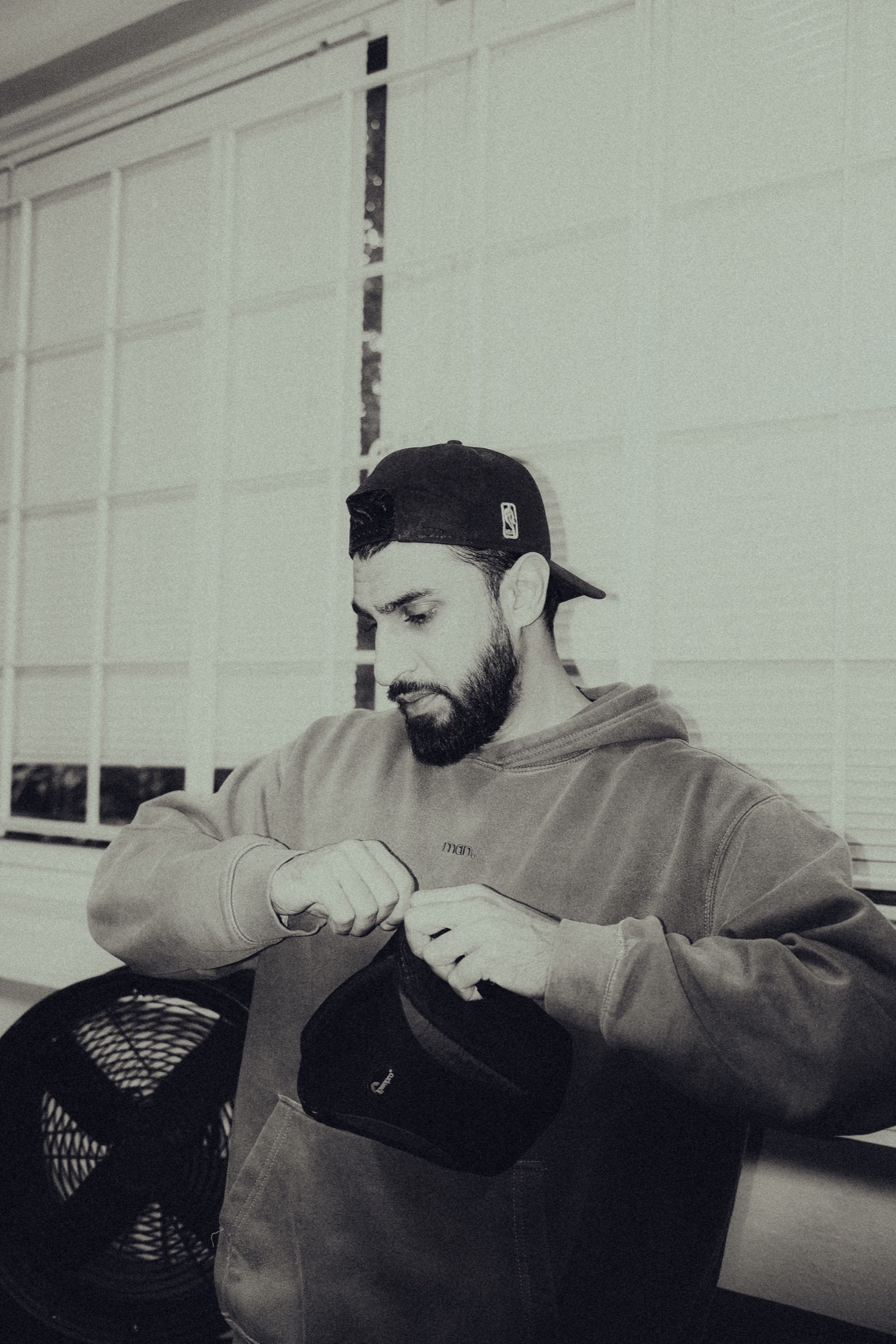 Musician seated with an acoustic guitar